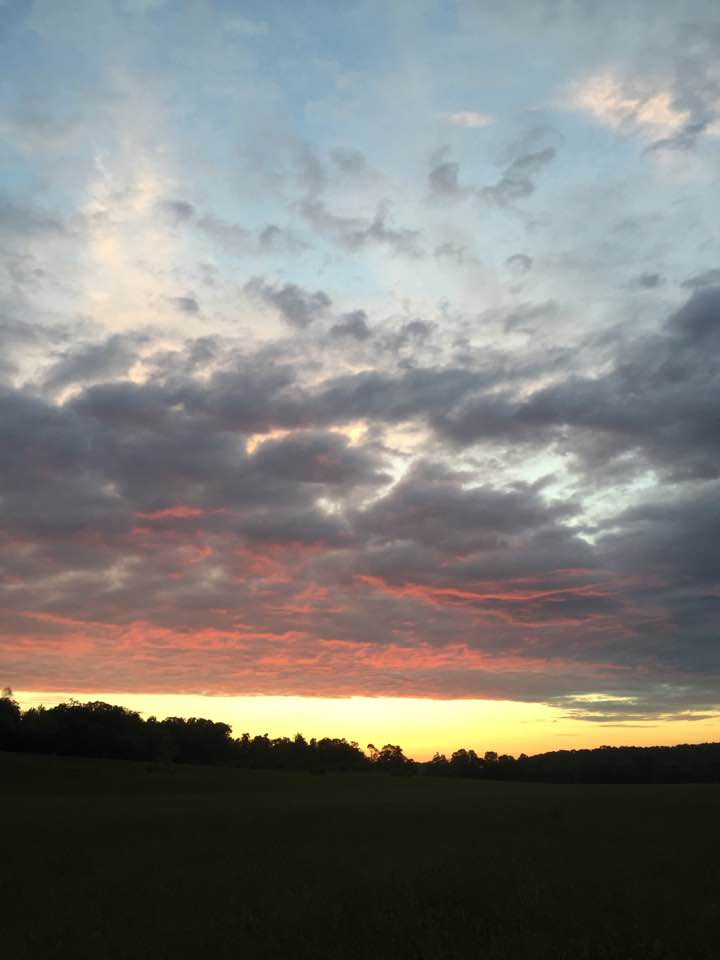 cloudy and sunset over field - washington county guide